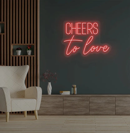 Modern wedding backdrop featuring Cheers to Love red neon sign.