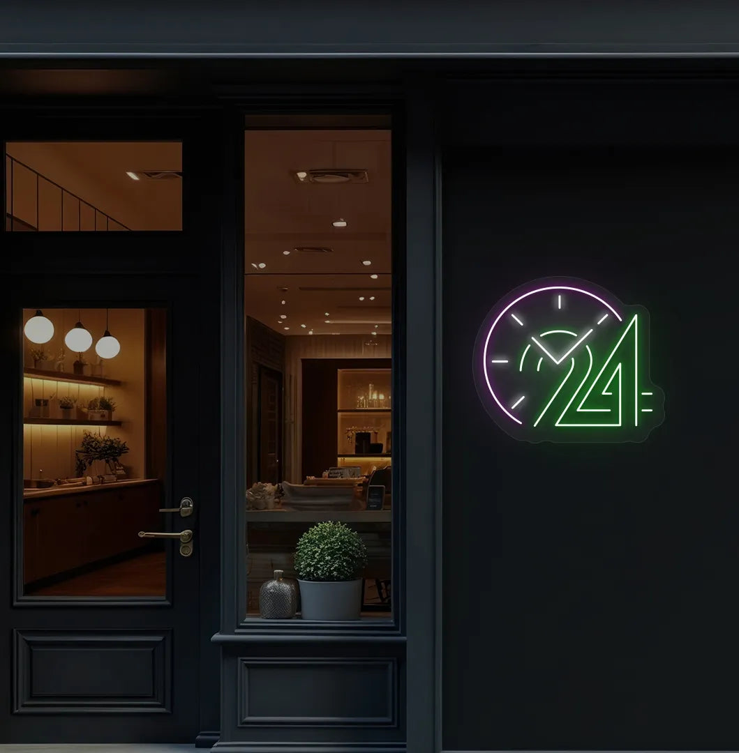 Stylish "24 hour clock" neon sign in green mounted on storefront wall.