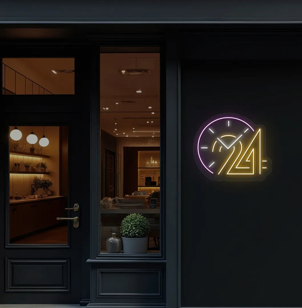 Stylish "24 hour clock" neon sign in orange mounted on storefront wall.