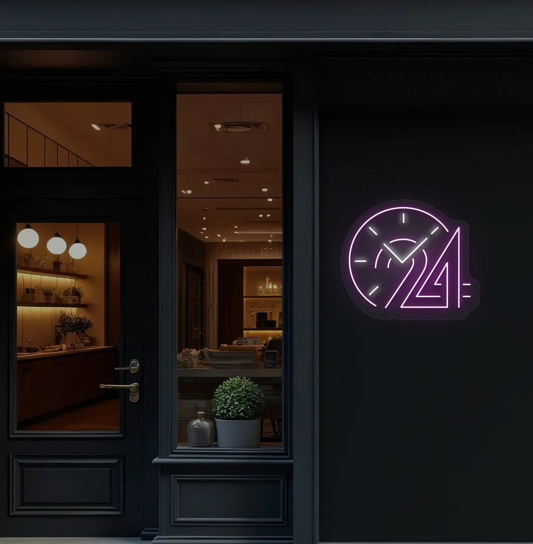 Stylish "24 hour clock" neon sign in purple mounted on storefront wall.