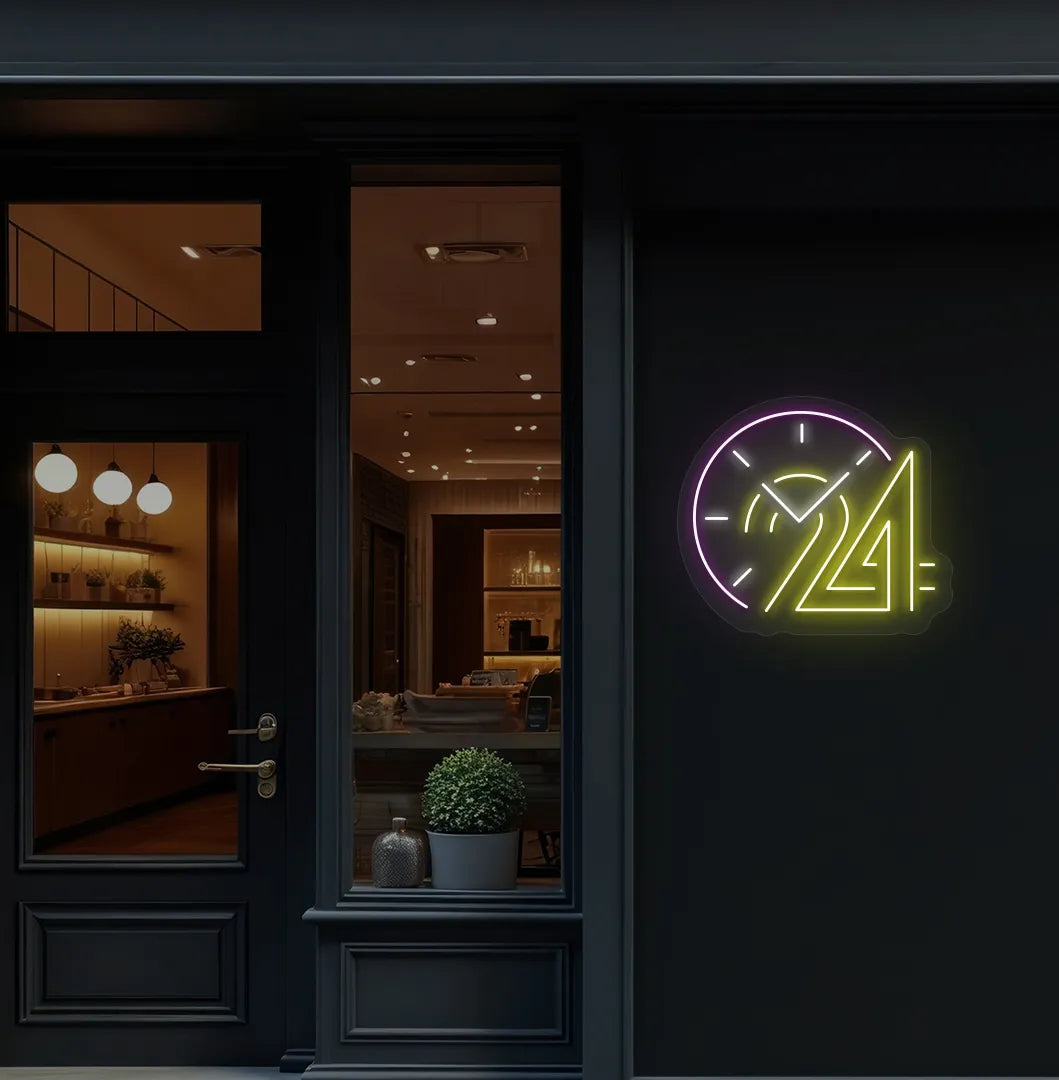 Stylish "24 hour clock" neon sign in yellow mounted on storefront wall.