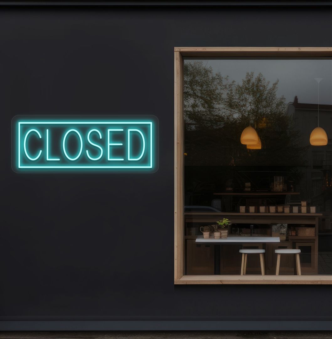 Image of a closed neon sign glowing on shop exterior wall in ice blue color.
