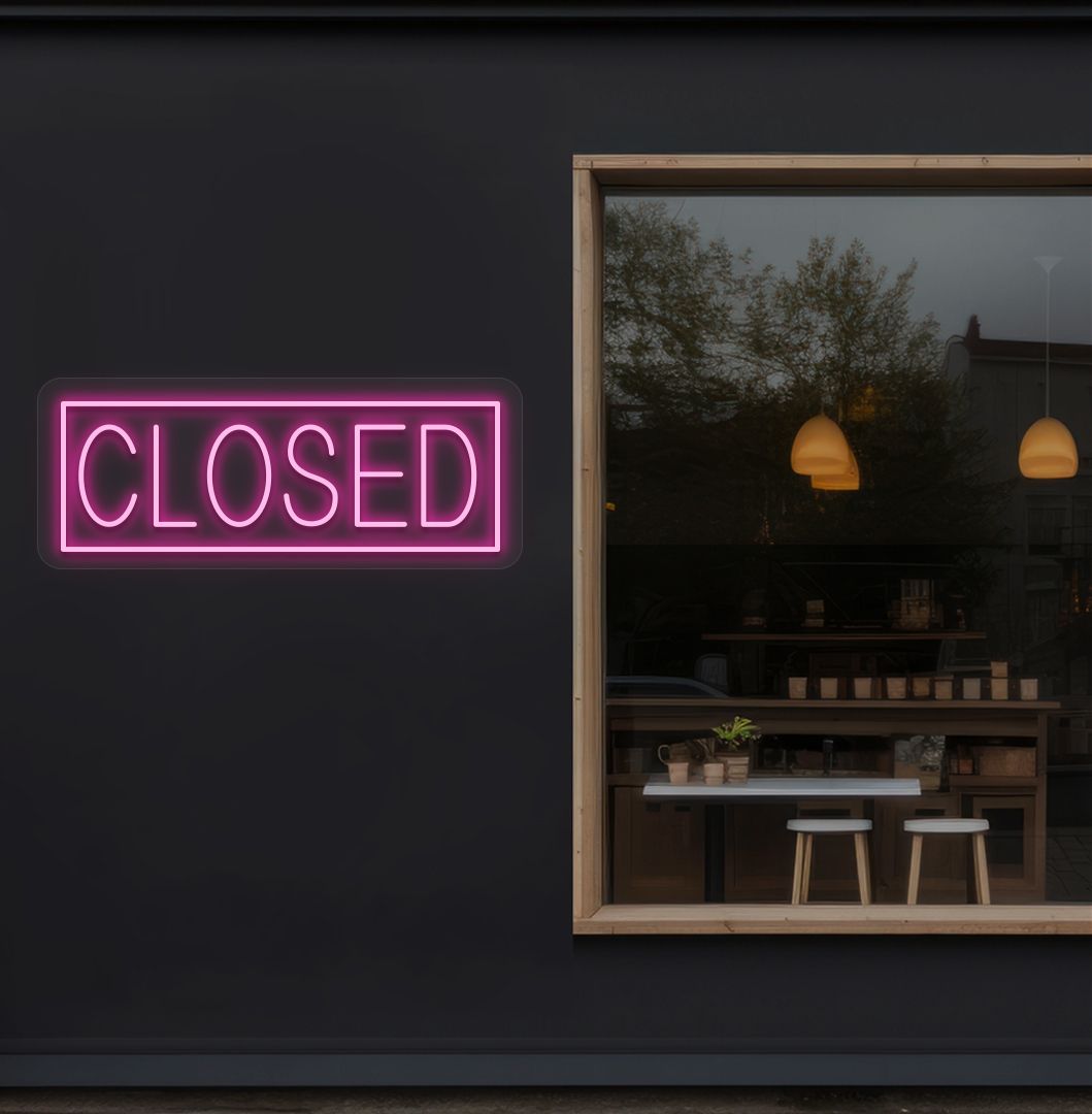 Image of a closed neon sign glowing on shop exterior wall in pink color.