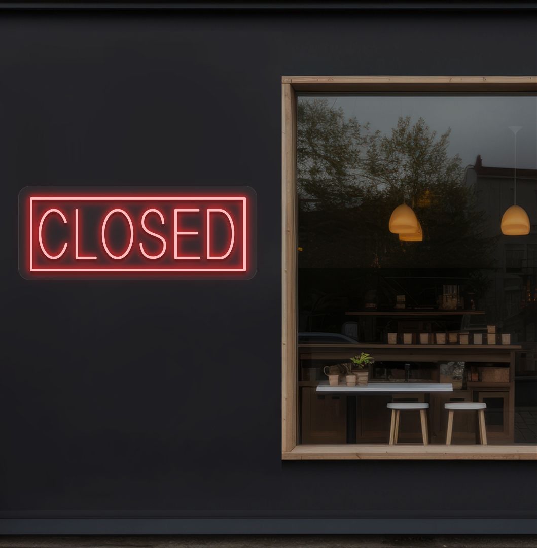 Image of a closed neon sign glowing on shop exterior wall in red color.