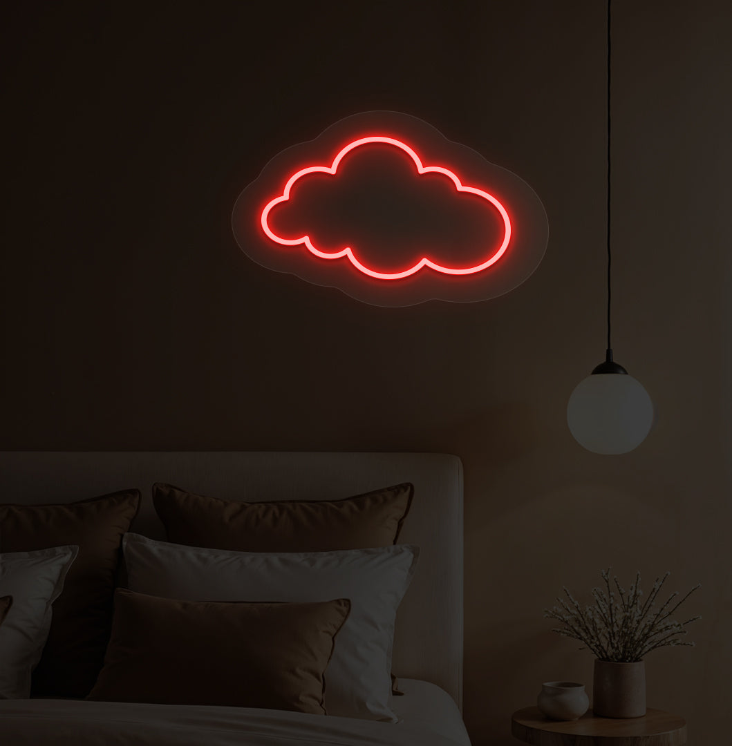 A red cloud LED neon sign hanging on a bedroom wall for kids' room decor.