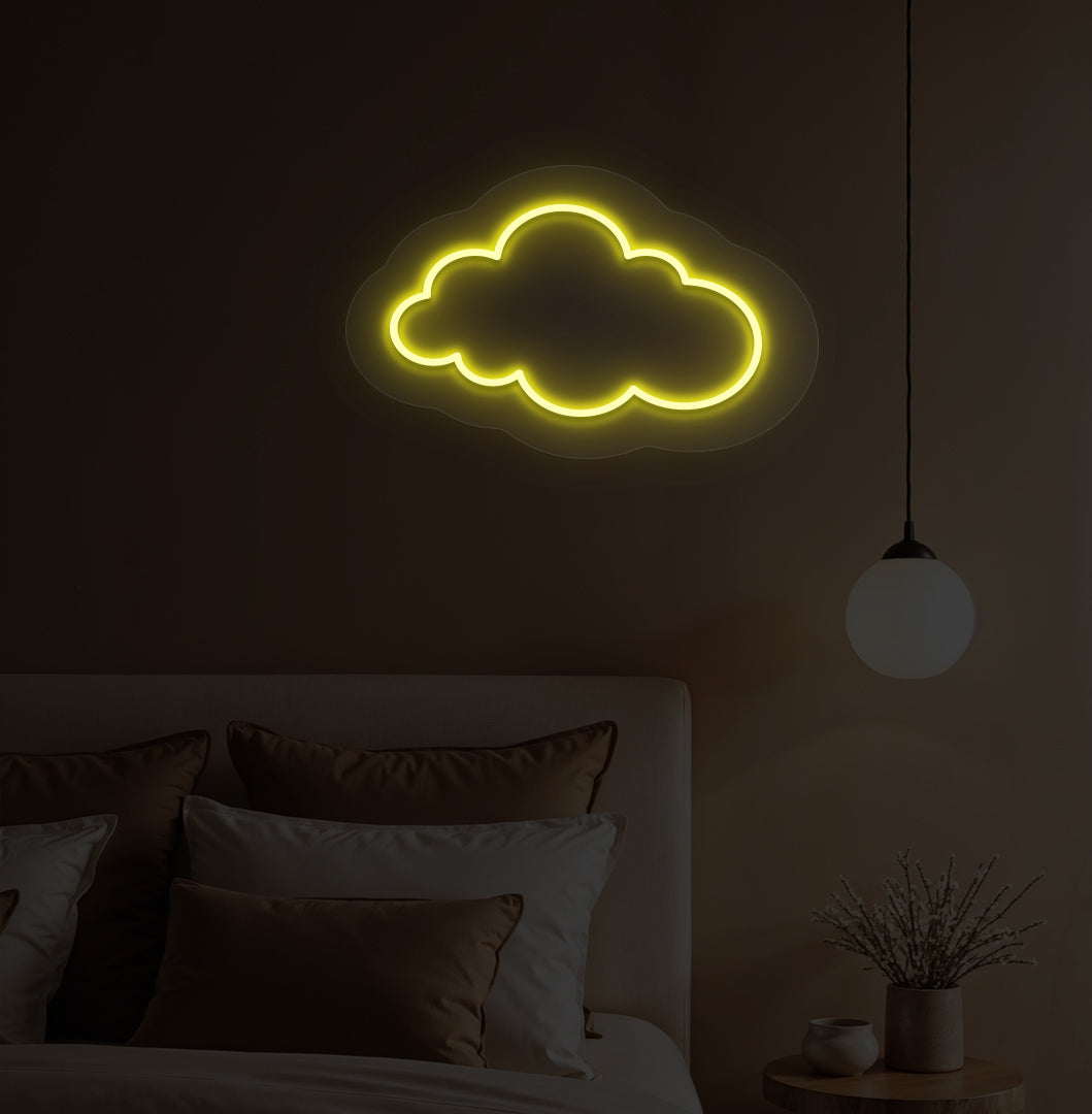 Image of a cloud LED neon light in yellow color on a kid's bedroom wall.