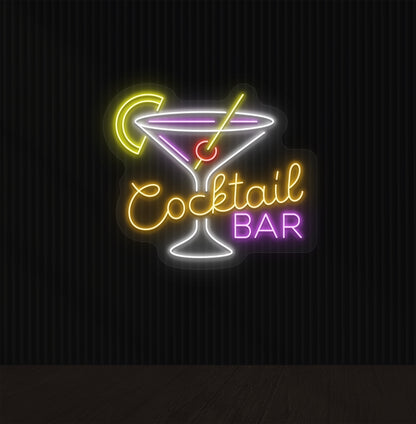 Image of an orange cocktail bar neon sign mounted on a wall with a martini glass, straw, and strawberry.