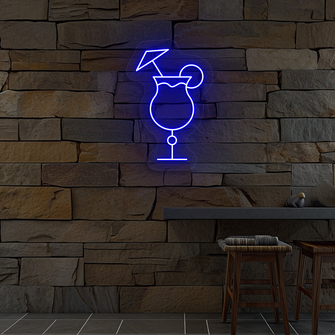 Image of a "cocktail glass with a lime" neon sign glowing on wall in blue color.