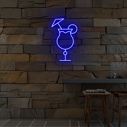 Image of a "cocktail glass with a lime" neon sign glowing on wall in blue color.
