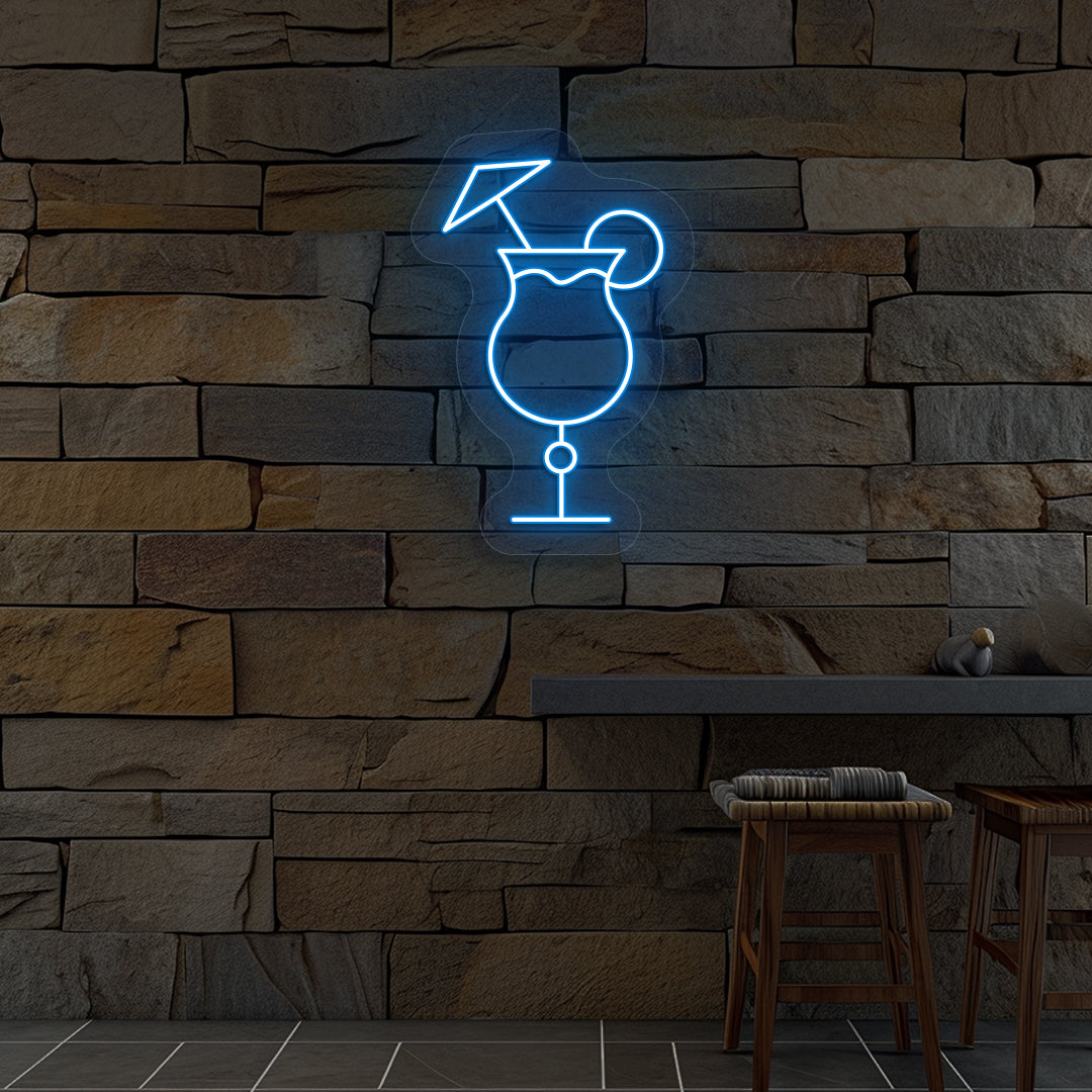 Image of a "cocktail glass with a lime" neon sign glowing on wall in ice blue color.