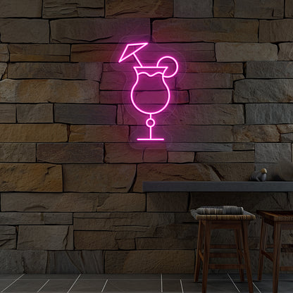 Image of a "cocktail glass with a lime" neon sign glowing on wall in pink color.