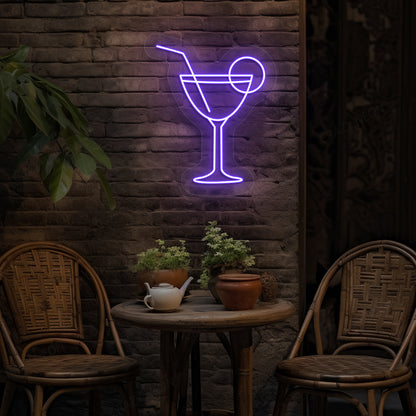 Stylish cocktail neon sign glowing purple on bar wall.
