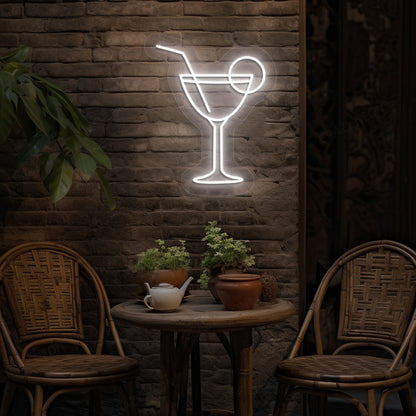 Image of a cocktail LED neon sign glowing on a bar wall in white color.