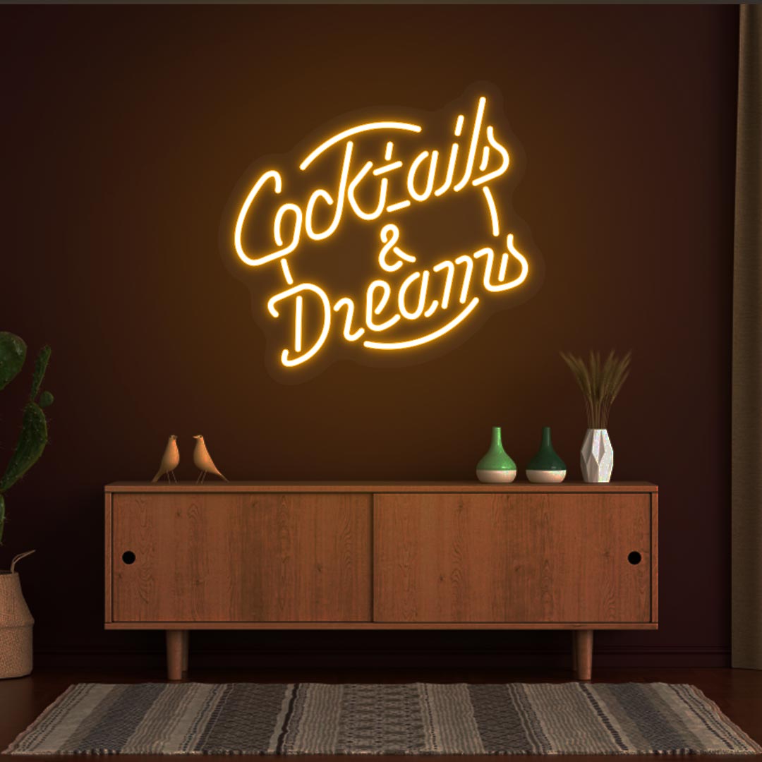 Orange LED cocktail and dreams neon signs are hanging on the bar wall. Perfect for bars, cocktail lounges, and home bar setups.