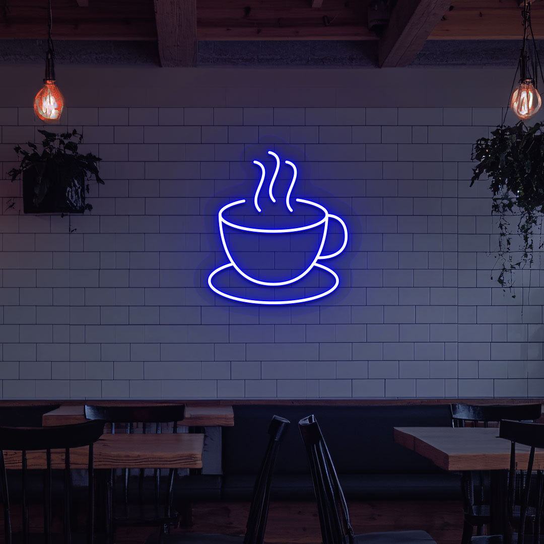 Stylish coffee mug neon sign in blue LED on cafe interior wall.