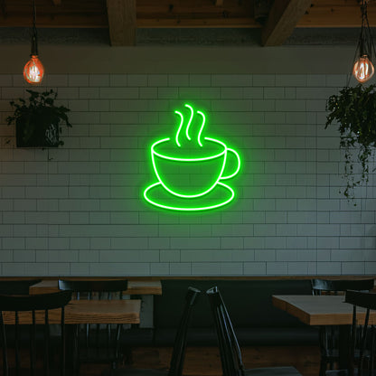 Image of a coffee mug neon sign mounted on a cafe wall in green color.