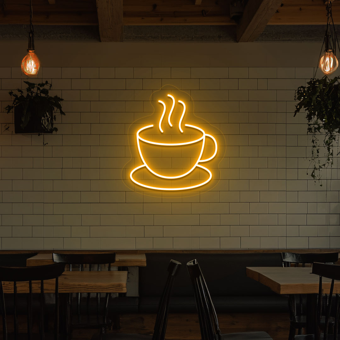 Image of a coffee mug neon sign mounted on a cafe wall in orange color.