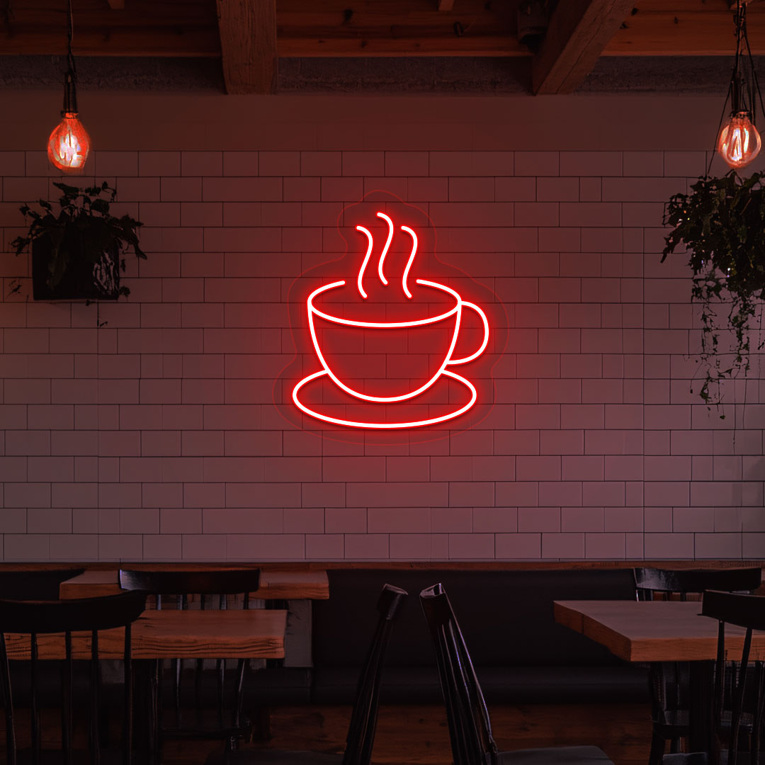 Stylish coffee mug neon sign in red LED on cafe interior wall.