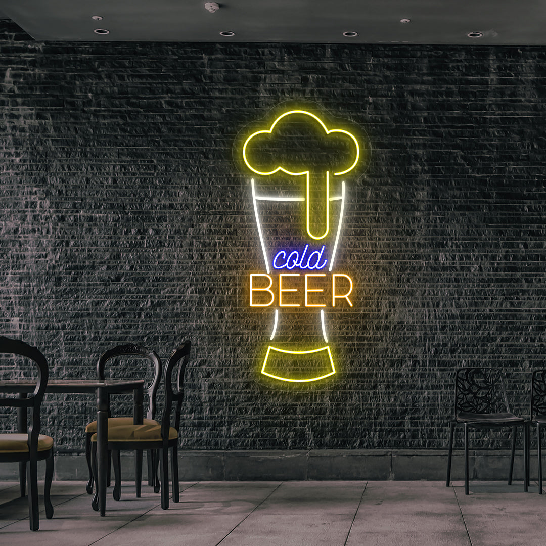 Image of a cold beer glass neon sign glowing on wall in yellow, warm white, orange, blue color.