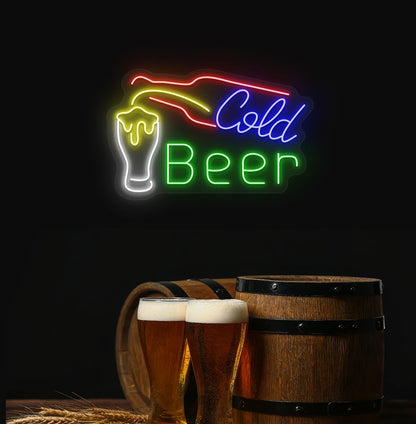 Modern aesthetic wall with cold beer neon sign glowing green with bottle and glass.