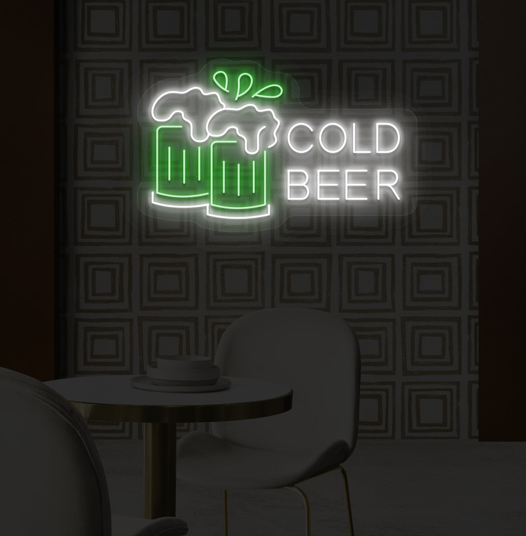 A stylish green LED cold beer neon sign glowing on a bar wall with the beer glass setup.
