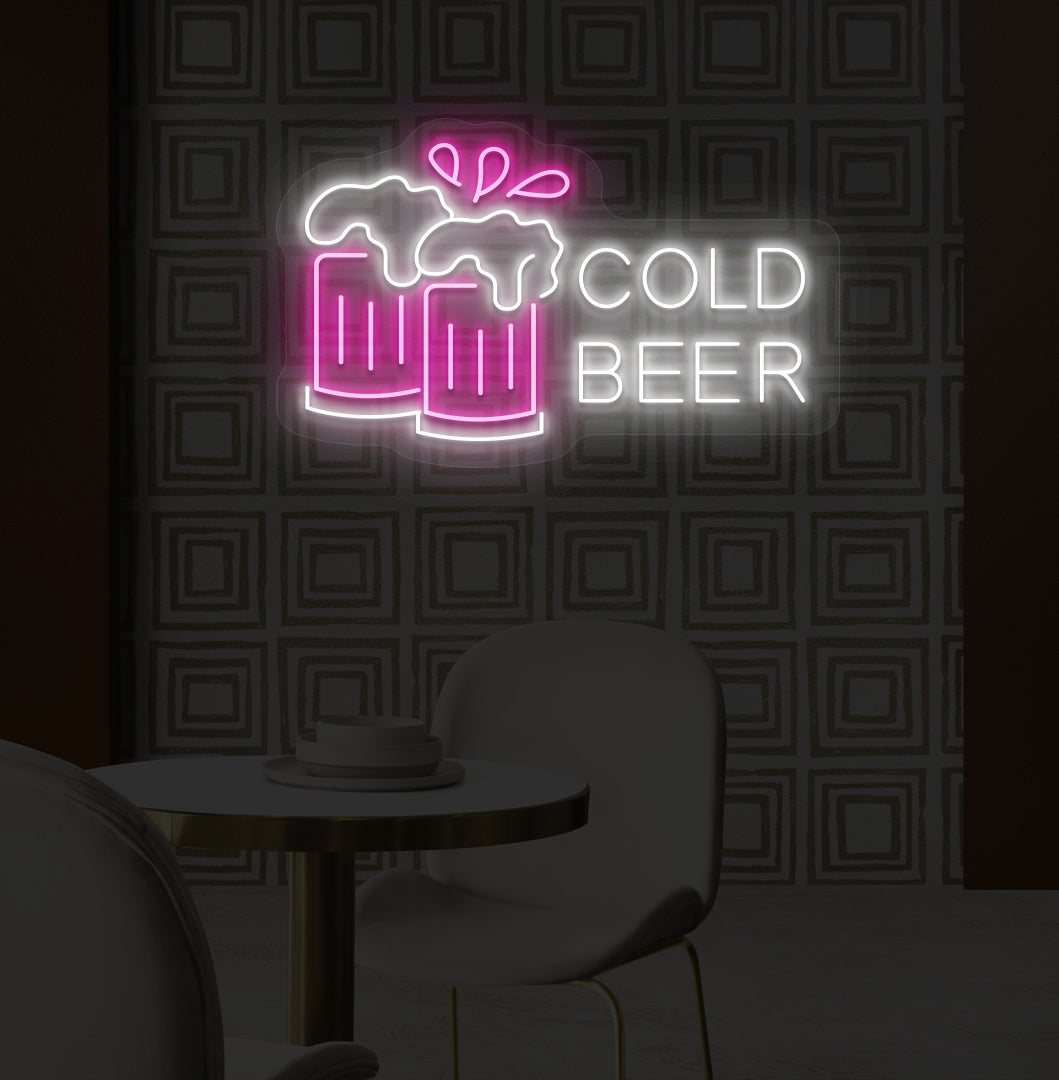 A stylish pink LED cold beer neon sign glowing on a bar wall with the beer glass setup.