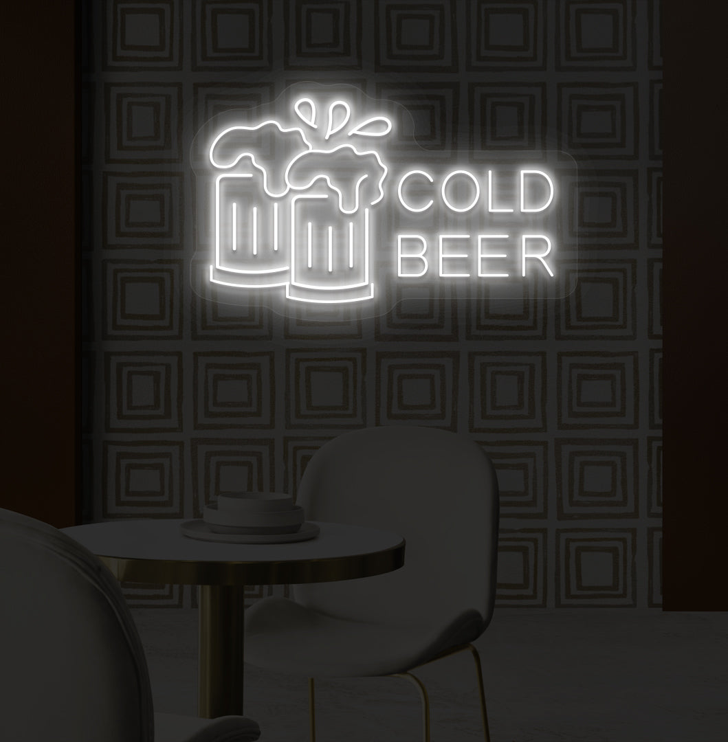 A stylish white LED cold beer neon sign glowing on a bar wall with the beer glass setup.