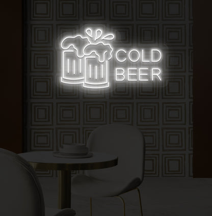 A stylish white LED cold beer neon sign glowing on a bar wall with the beer glass setup.