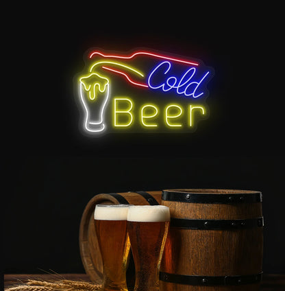 Modern aesthetic wall with cold beer neon sign glowing yellow with bottle and glass.