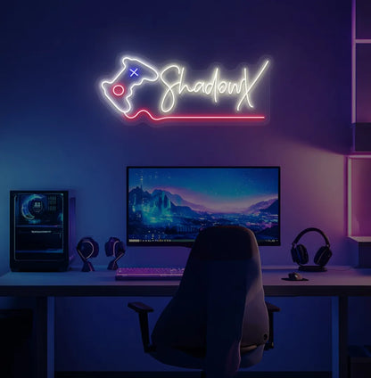 Controller with Custom Name neon sign glowing warm white on gaming room wall.