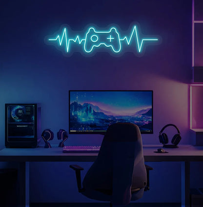 Image of a gaming controller with heartbeat ice blue neon sign mounted on gamer room wall.