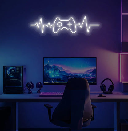 Image of a gaming controller with heartbeat white neon sign mounted on gamer room wall.
