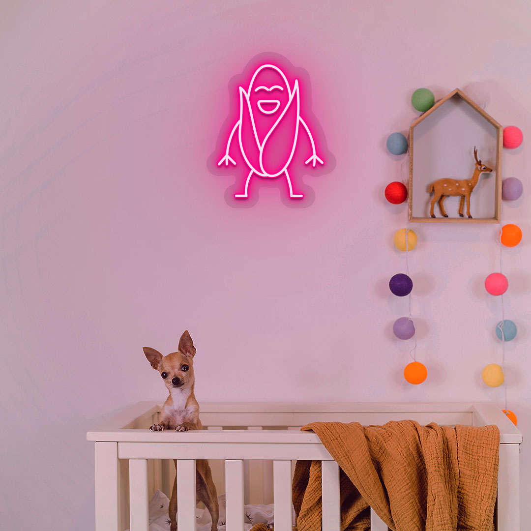 Image of a corn neon sign glowing on a kid's room wall in pink color above a cute dog.