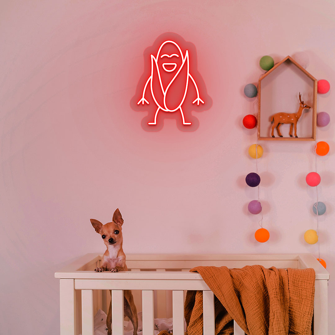 Image of a corn neon sign glowing on a kid's room wall in red color above a cute dog.