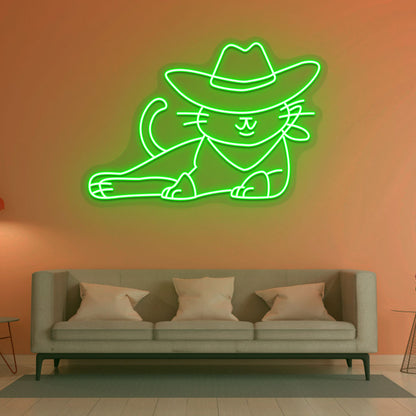 Image of a cowboy cat LED neon sign in green color mounted on a wall in a drawing room.
