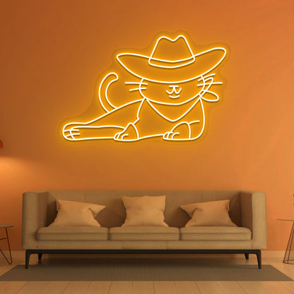 Cat with cowboy hat neon sign in orange on the wall. Perfect for living room décor and pet lovers’ spaces.