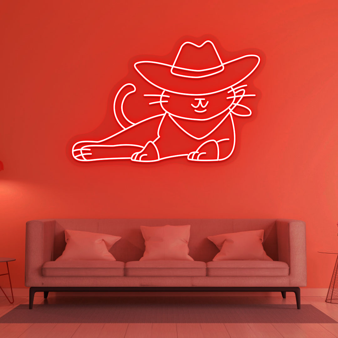 Image of a cowboy cat LED neon sign in red color mounted on a wall in a drawing room.