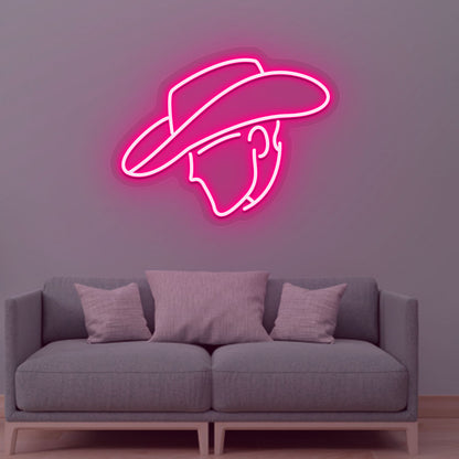 Stylish cowboy face pink LED neon sign glowing on the wall. Perfect for living rooms, western-themed interiors, bars, lounges, and man caves.