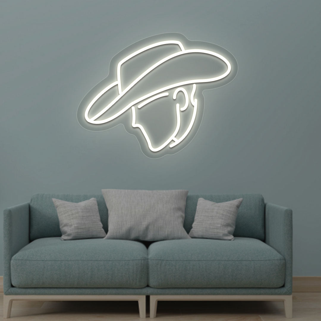 Western style cowboy warm white LED neon sign mounted on a living room wall.