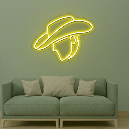 Western style cowboy yellow LED neon sign mounted on a living room wall.