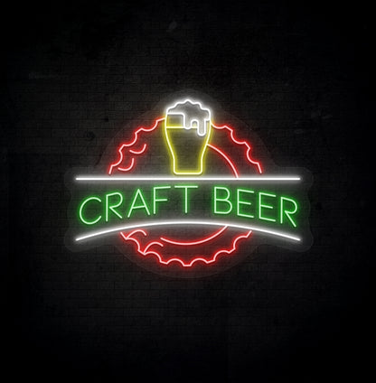 Stylish green LED craft beer neon sign with beer design glowing on wall.
