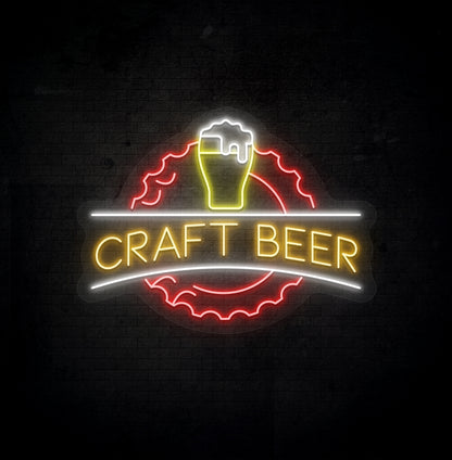 Stylish orange LED craft beer neon sign with beer design glowing on wall.