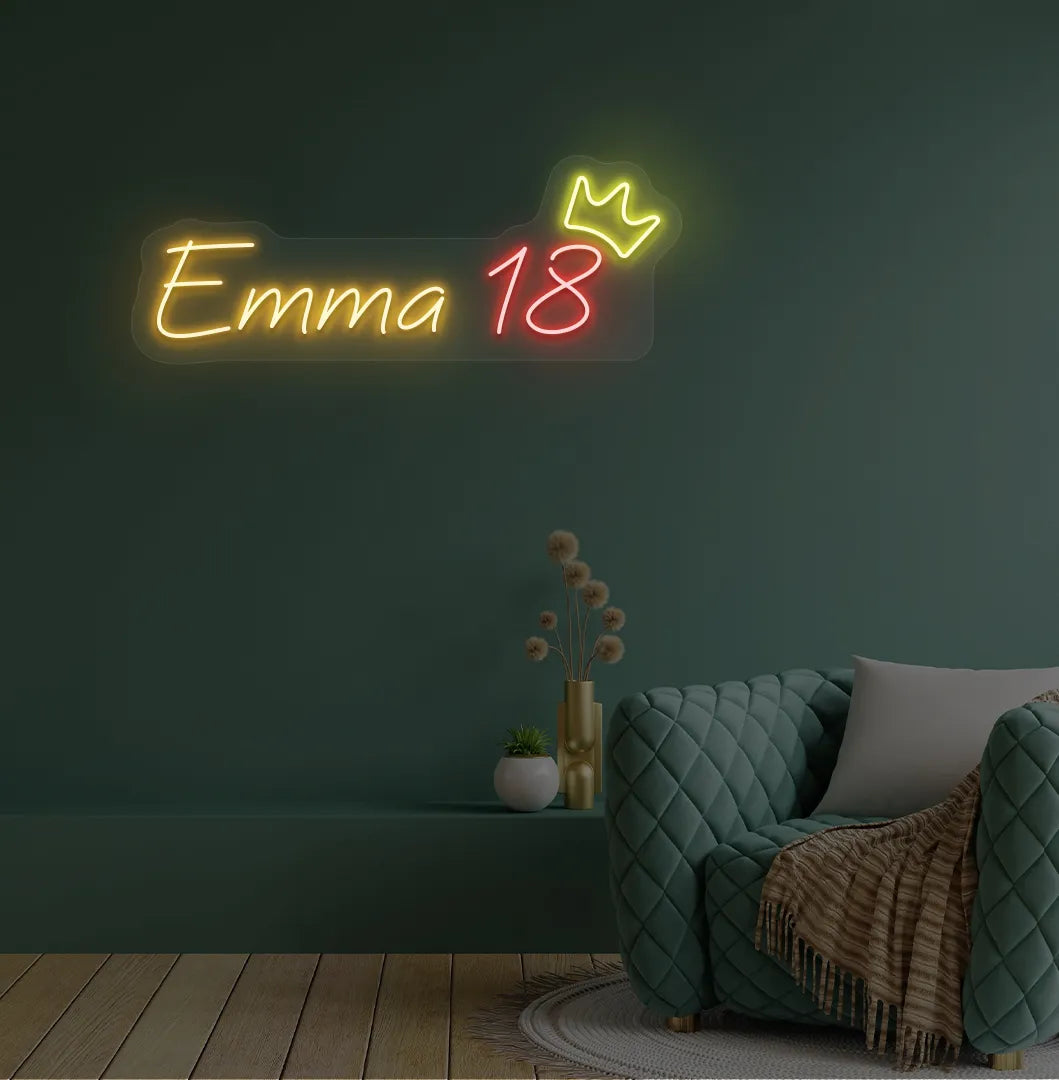 Personalized birthday name and age neon sign mounted on modern party backdrop wall in orange color.