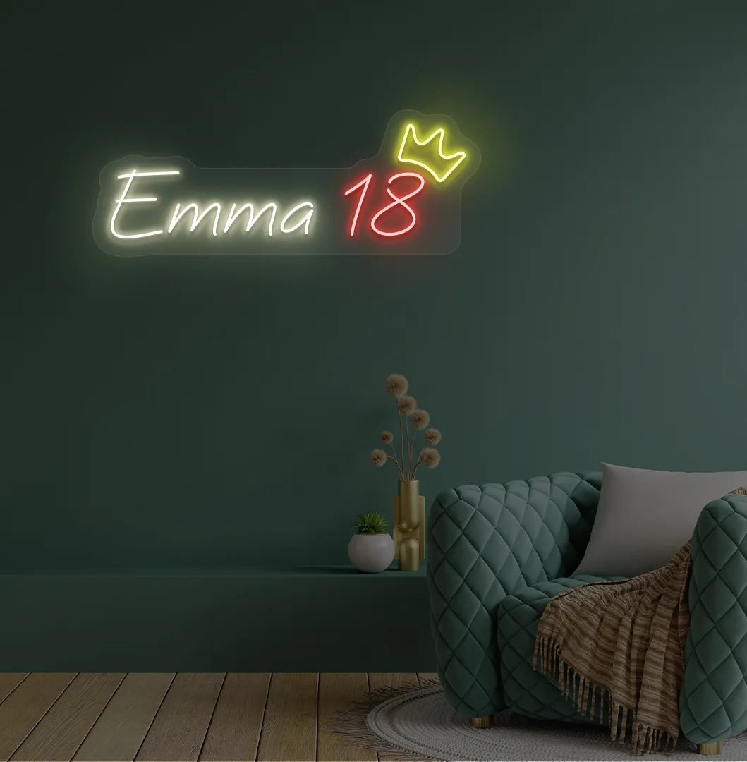 Personalized birthday name and age neon sign mounted on modern party backdrop wall in warm white color.