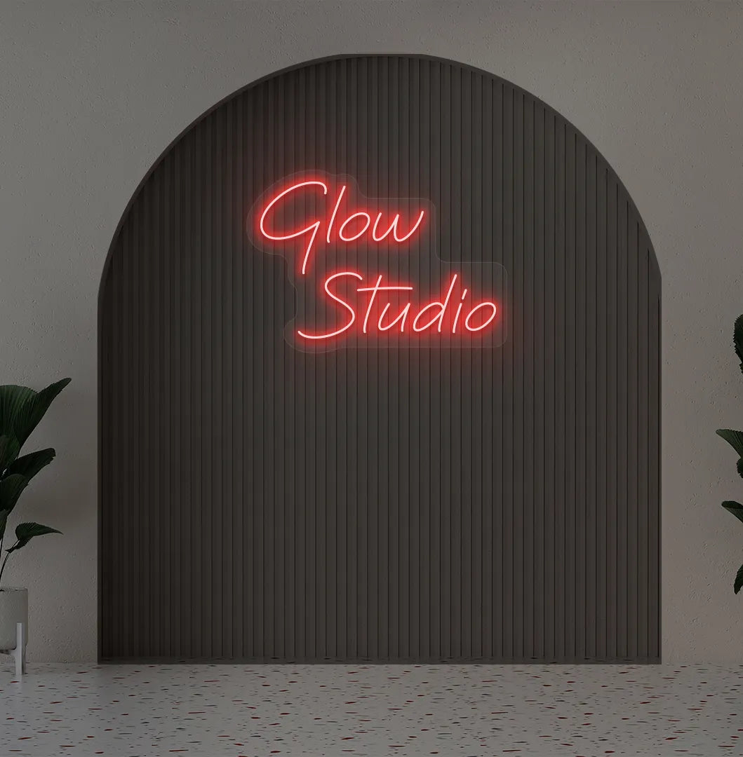 Personalized business name neon sign in red color mounted on aesthetic wall.