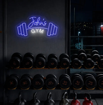Stylish personalized gym name neon sign with dumbbell mounted on aesthetic wall in blue color.