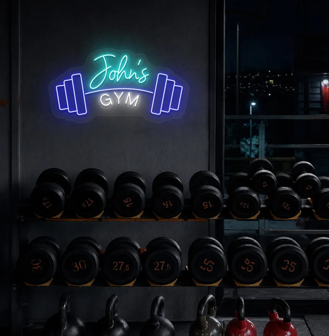 Stylish personalized gym name neon sign with dumbbell mounted on aesthetic wall in ice blue color.
