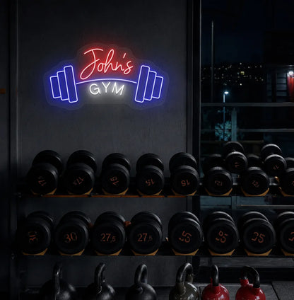 Stylish personalized gym name neon sign with dumbbell mounted on aesthetic wall in red color.