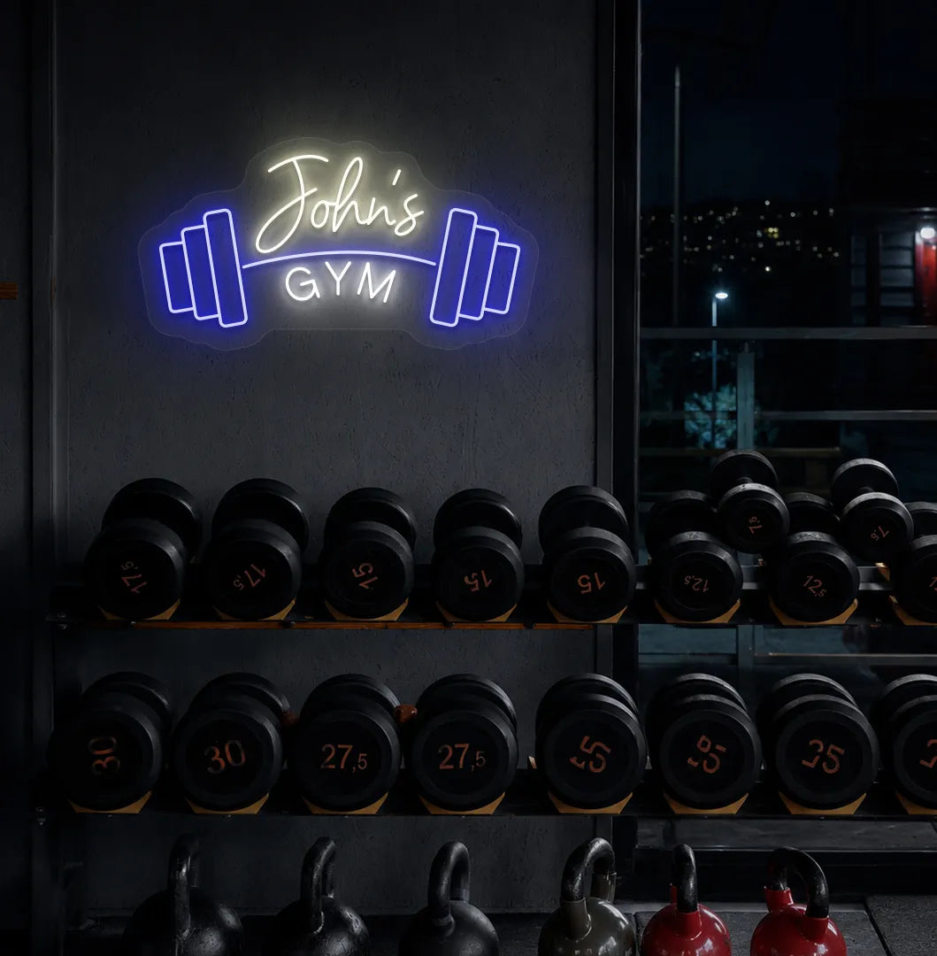 Custom GYM Name with Dumbbell LED neon sign mounted on modern fitness studio wall in warm white color.