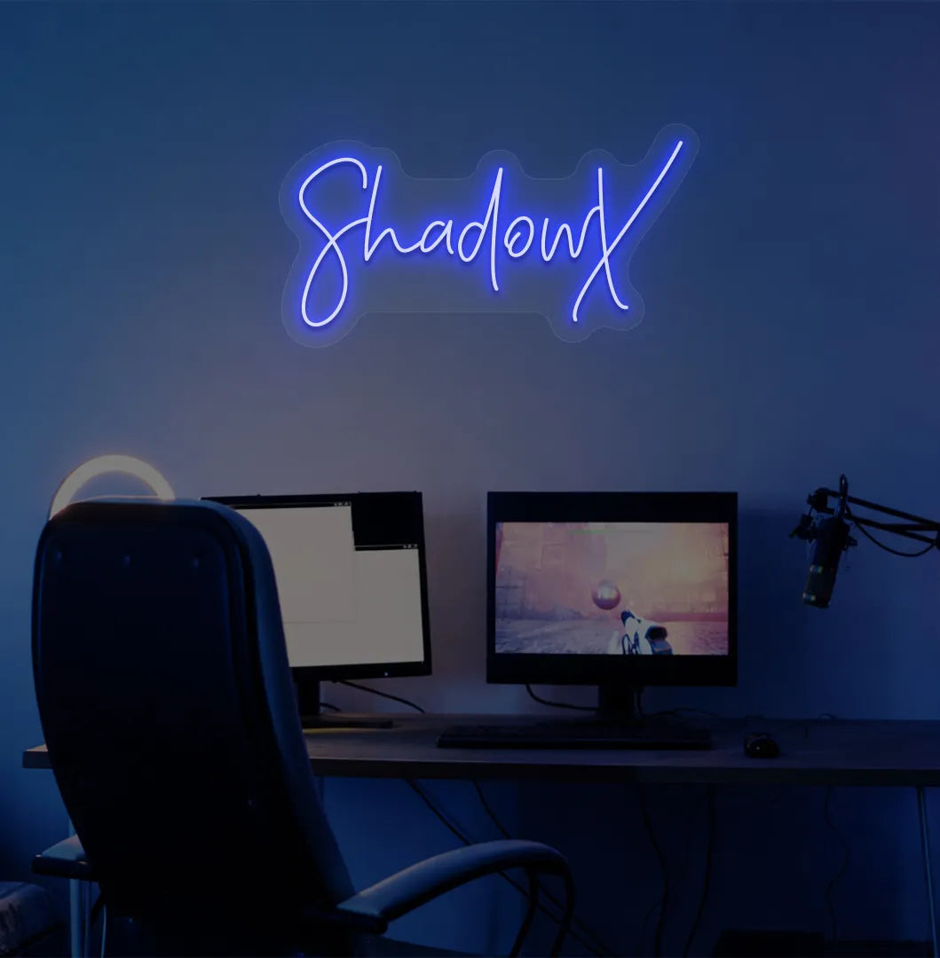 Custom gamer tag blue LED neon sign mounted on modern gaming wall.